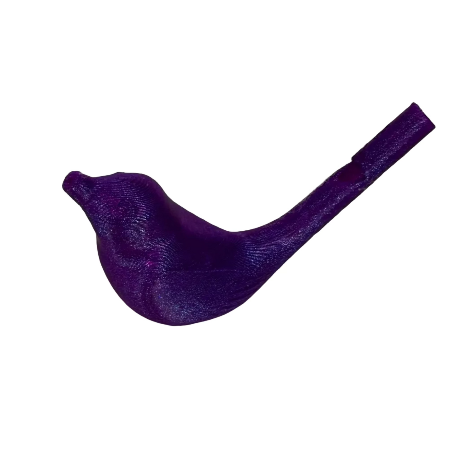 Purple bird-shaped object on a white surface